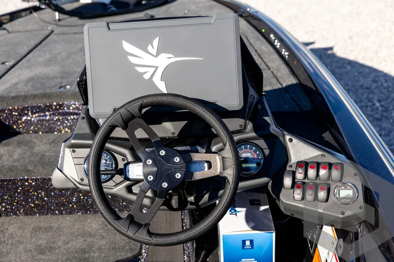 Slide: The Image of Steering console of 2026 Skeeter ZXE20 boat with modern dashboard and controls. - 58