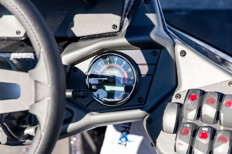 Slide: The Image of Dashboard of 2026 Skeeter ZXE20 boat with tachometer and control panel. - 60