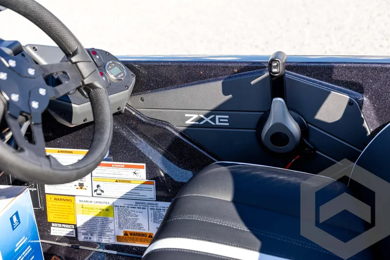 Slide: The Image of Interior of 2026 Skeeter ZXE20 boat showing steering wheel and control panel. - 65