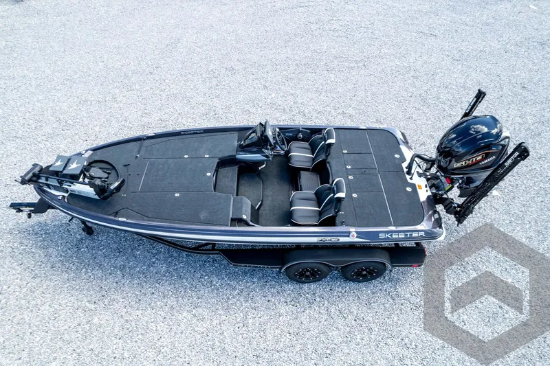 Slide: The Image of 2026 Skeeter ZXE20 fishing boat on gravel, featuring sleek design and dual seating. - 81