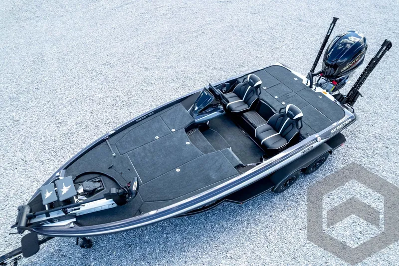 Slide: The Image of 2026 Skeeter ZXE20 fishing boat on gravel, featuring dual seats and advanced equipment. - 82