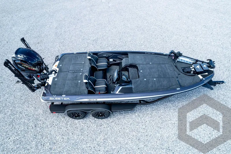 Slide: The Image of 2026 Skeeter ZXE20 fishing boat with Yamaha engine, aerial view on gravel surface. - 85