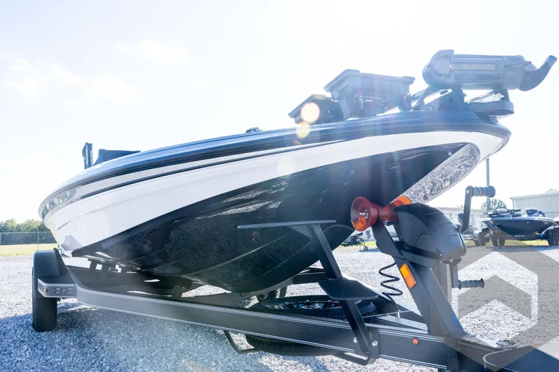 Slide: The Image of 2026 Skeeter ZXE20 boat on trailer, sunlit, showcasing sleek design and modern features. - 9