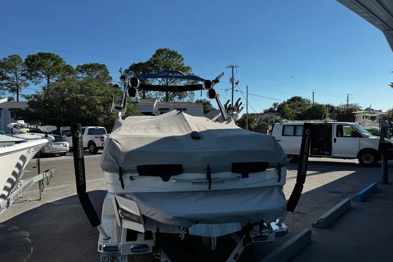 Slide: The Image of 2022 Malibu Wakesetter 23 LSV boat covered and parked outdoors. - 10