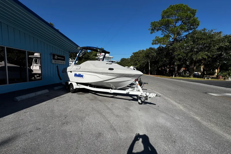 Slide: The Image of 2022 Malibu Wakesetter 23 LSV boat on trailer outside dealership. - 13