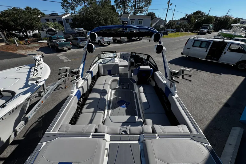 Slide: The Image of 2022 Malibu Wakesetter 23 LSV boat with spacious seating and sleek design. - 16