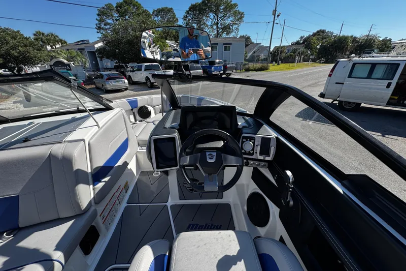 Slide: The Image of 2022 Malibu Wakesetter 23 LSV boat interior with modern dashboard and steering wheel. - 22