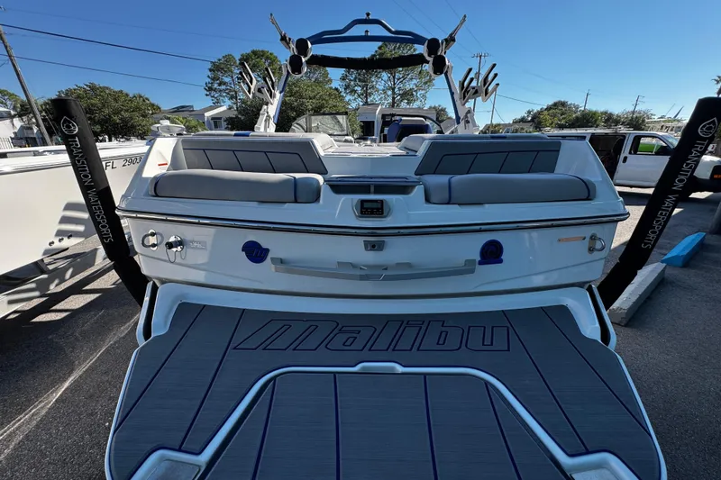 Slide: The Image of 2022 Malibu Wakesetter 23 LSV boat, rear view, parked outdoors. - 25
