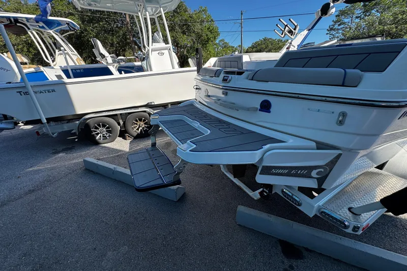 Slide: The Image of 2022 Malibu Wakesetter 23 LSV boat with swim platform and sleek design. - 28