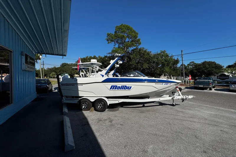 Slide: The Image of 2022 Malibu Wakesetter 23 LSV boat on trailer outside dealership. - 4