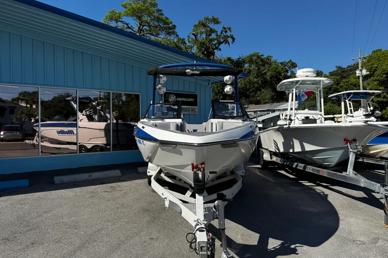 Slide: The Image of 2022 Malibu Wakesetter 23 LSV boat on trailer outside dealership. - 6