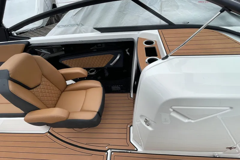 Slide: The Image of 2026 Yamaha Boats 252SE interior with tan seating and wood-style flooring. - 10