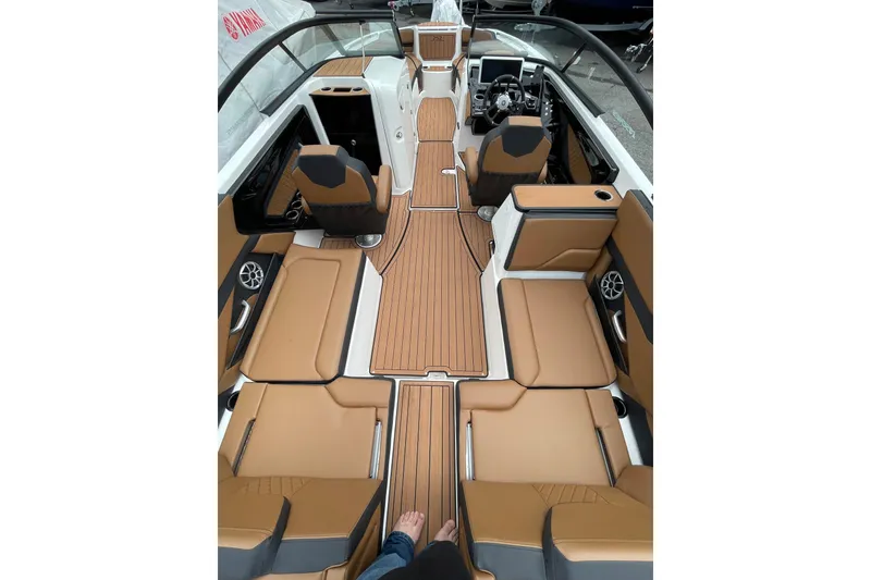 Slide: The Image of 2026 Yamaha Boats 252SE interior with tan seating and sleek design. - 16