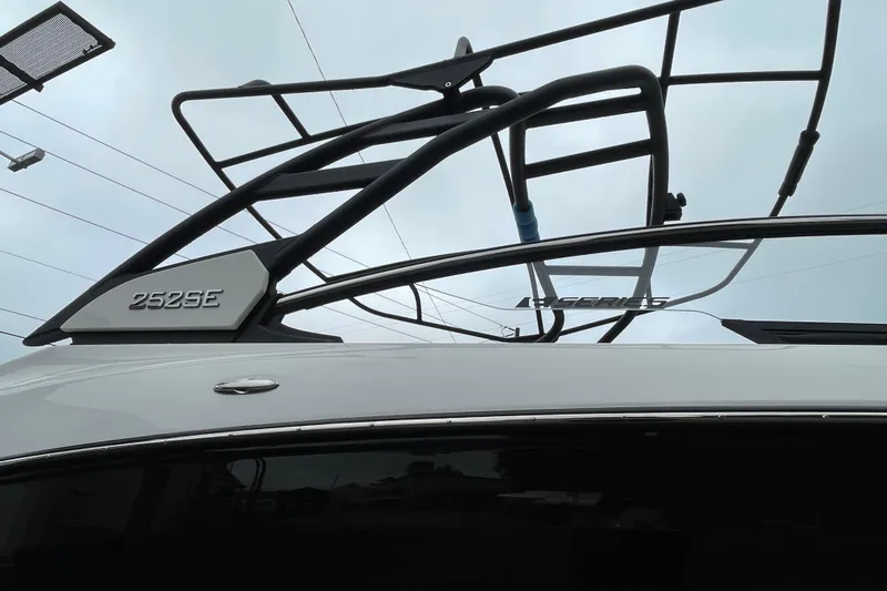 Slide: The Image of 2026 Yamaha Boats 252SE, sleek design with modern framework against a cloudy sky. - 2