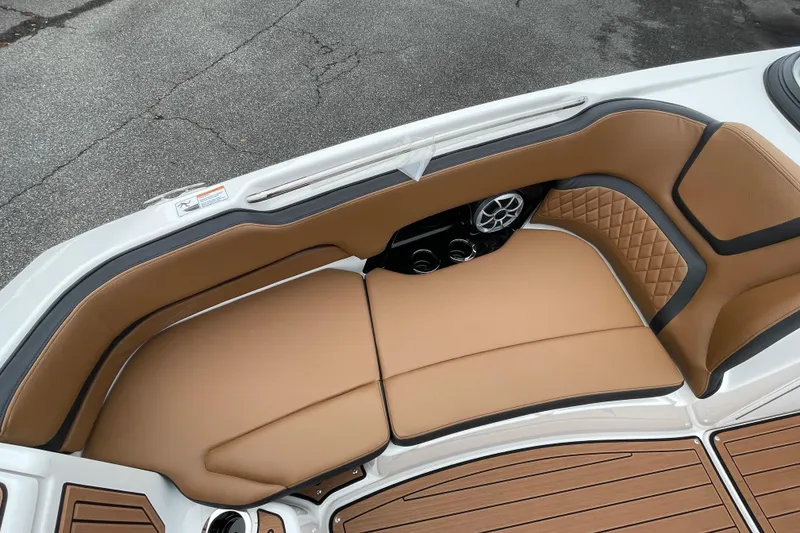 Slide: The Image of 2026 Yamaha Boats 252SE interior with tan seating and speaker system. - 5