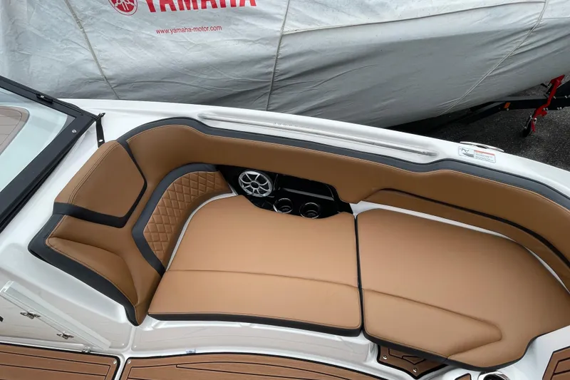 Slide: The Image of 2026 Yamaha Boats 252SE interior with tan seating and speaker system. - 6
