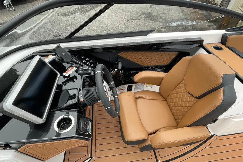 Slide: The Image of 2026 Yamaha Boats 252SE cockpit with tan leather seat and modern dashboard. - 8