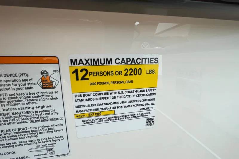 Slide: The Image of Yamaha Boats 252SE 2026 capacity label: 12 persons or 2200 lbs, safety compliance. - 9