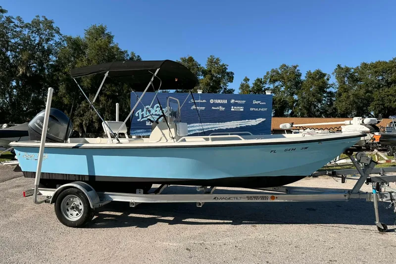 The Image of 2018 Stott Craft SCV202 boat on trailer, blue hull, outdoor display. - 1