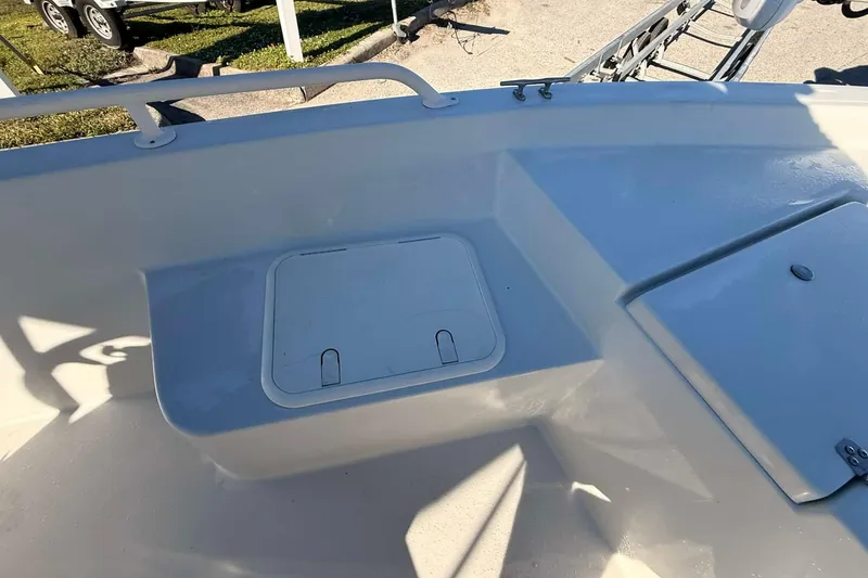 Slide: The Image of 2018 Stott Craft SCV202 boat interior with storage compartments and clean white finish. - 10