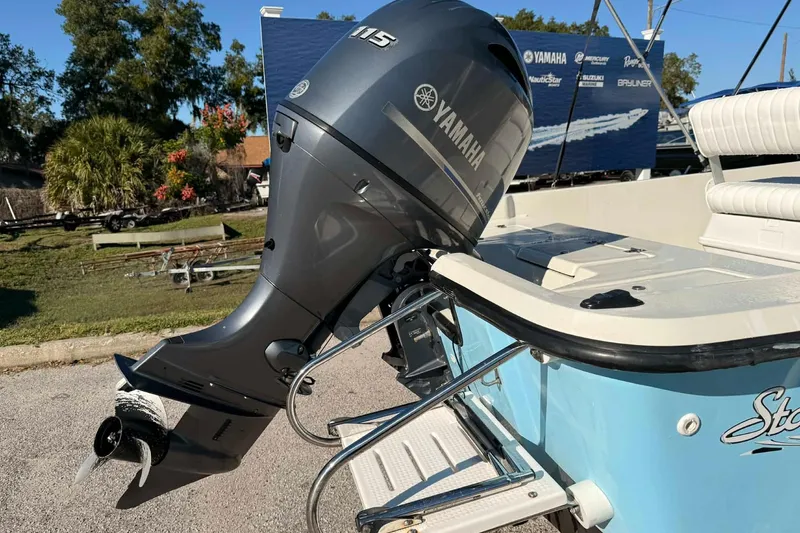 Slide: The Image of 2018 Stott Craft SCV202 boat with Yamaha 115 outboard motor, parked outdoors. - 3
