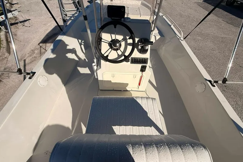 Slide: The Image of 2018 Stott Craft SCV202 boat interior with steering wheel and seating. - 5