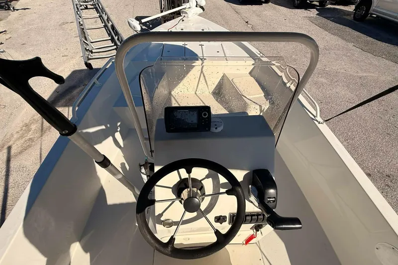 Slide: The Image of 2018 Stott Craft SCV202 boat console with steering wheel and controls. - 6