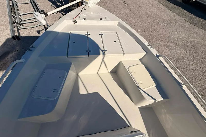 Slide: The Image of 2018 Stott Craft SCV202 boat interior with storage compartments and trolling motor. - 7