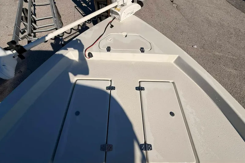 Slide: The Image of 2018 Stott Craft SCV202 boat deck with storage compartments and trolling motor. - 8
