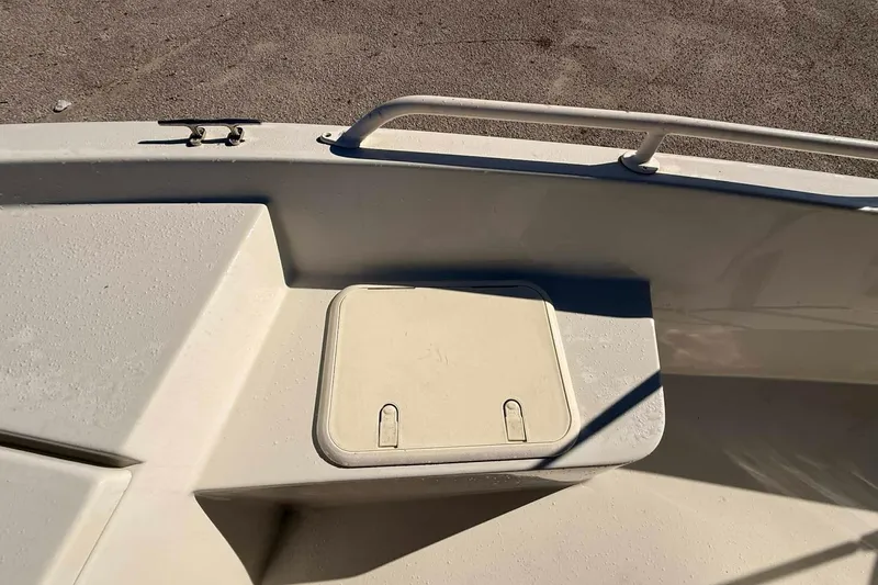 Slide: The Image of 2018 Stott Craft SCV202 boat deck with storage compartment and railing. - 9