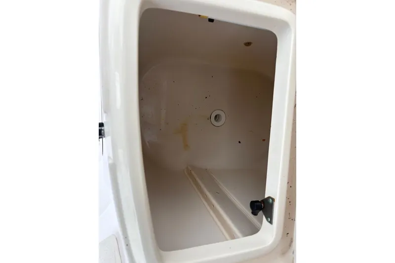Slide: The Image of Open storage compartment on 2004 Grady-White Express 330 boat. - 16