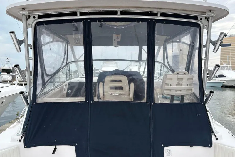 Slide: The Image of 2004 Grady-White Express 330 boat with enclosed cockpit at marina. - 4