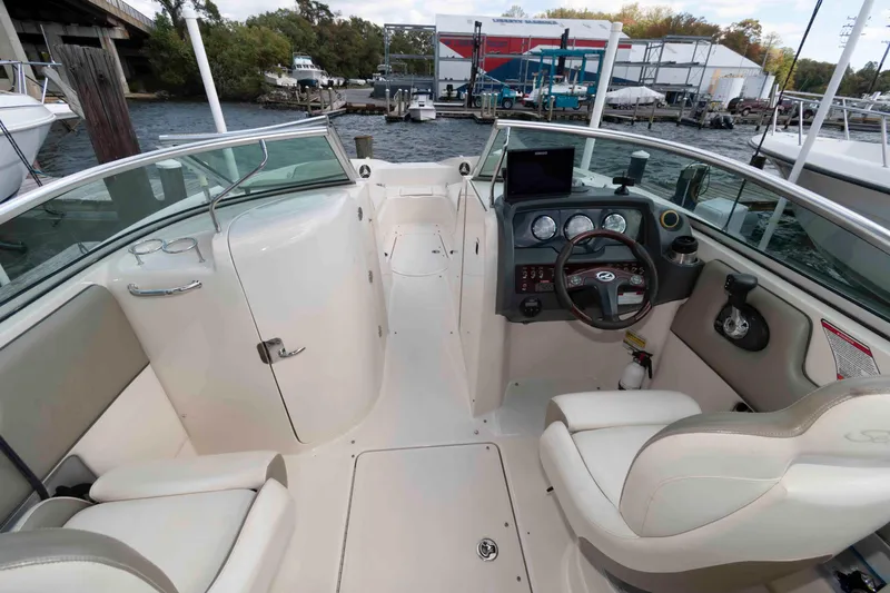 Slide: The Image of 2007 Sea Ray 260 Sundeck boat interior with steering wheel and dashboard controls. - 6