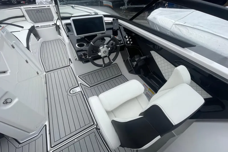 Slide: The Image of 2026 Yamaha Boats 252S cockpit with modern steering and seating design. - 16