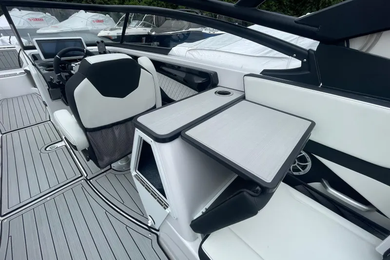 Slide: The Image of 2026 Yamaha Boats 252S interior with sleek seating and modern dashboard design. - 17
