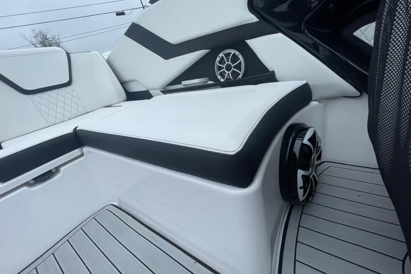 Slide: The Image of 2026 Yamaha Boats 252S interior with sleek white seating and modern speaker system. - 18