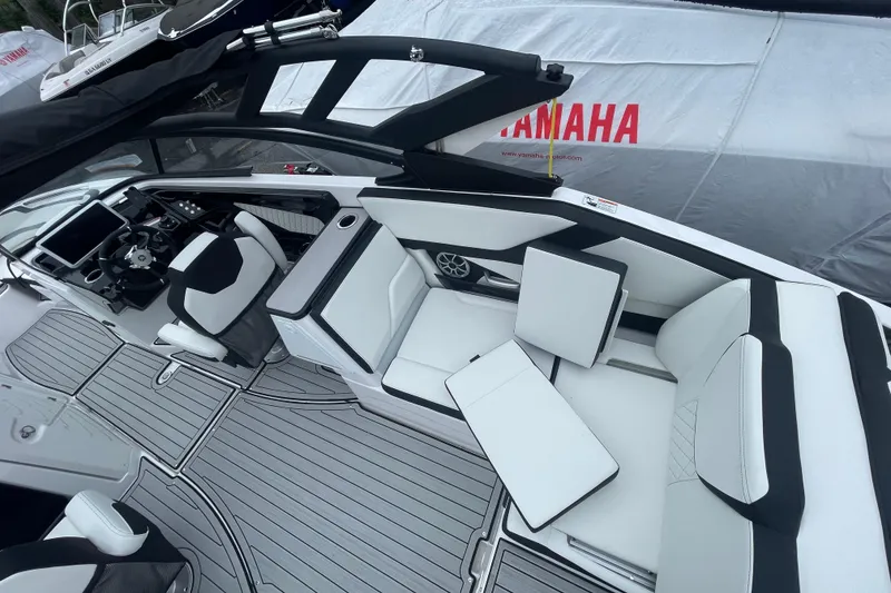 Slide: The Image of 2026 Yamaha Boats 252S interior with sleek seating and modern dashboard design. - 7
