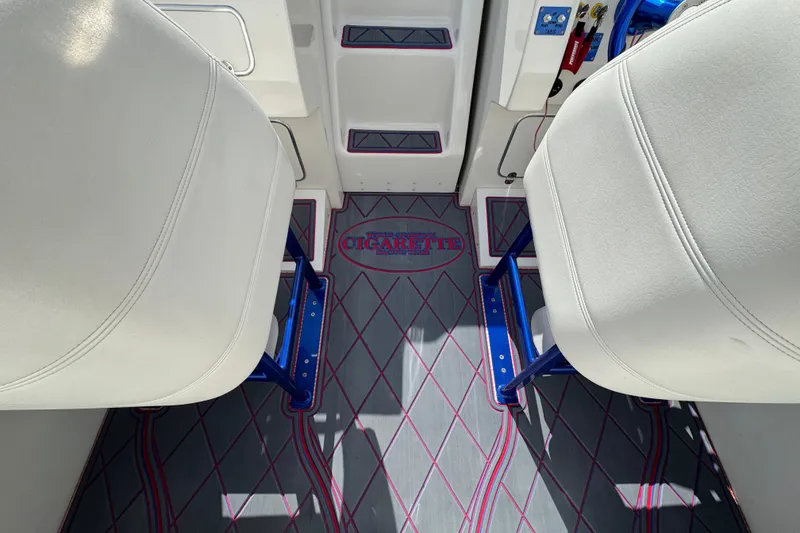 Slide: The Image of Interior of 2004 Cigarette 42 Tiger boat with white seats and custom flooring. - 10