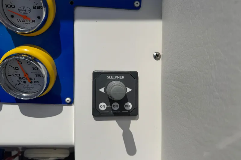 Slide: The Image of Control panel of a 2004 Cigarette 42 Tiger boat with gauges and switches. - 13