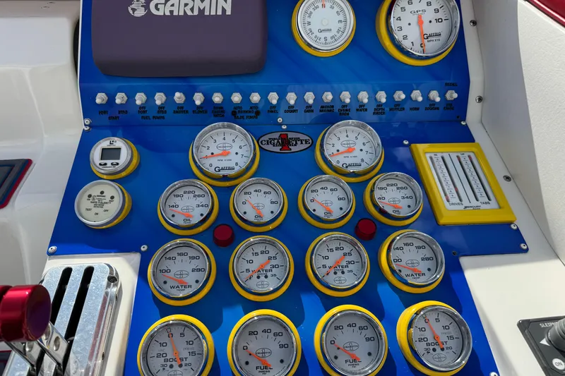 Slide: The Image of Dashboard of a 2004 Cigarette 42 Tiger boat with gauges and Garmin device. - 14