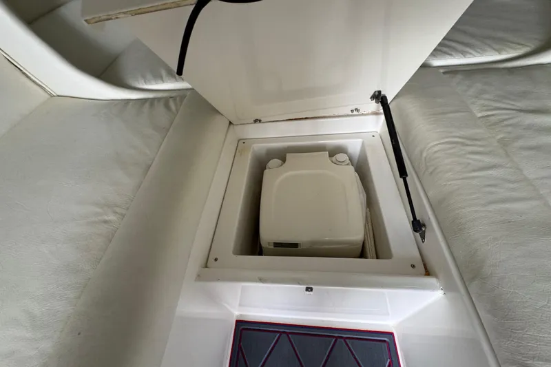 Slide: The Image of 2004 Cigarette 42 Tiger boat interior with hidden compartment and portable toilet. - 17