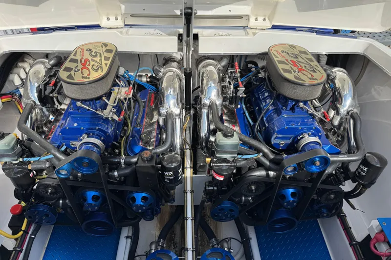 Slide: The Image of Twin engines of a 2004 Cigarette 42 Tiger boat, showcasing powerful mechanics. - 21