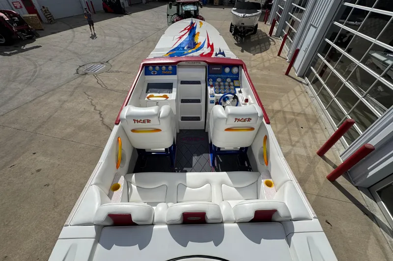 Slide: The Image of 2004 Cigarette 42 Tiger boat interior with vibrant seating and control panel. - 7