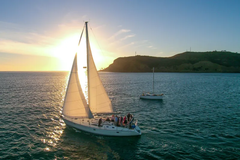 Slide: The Image of Sailboat Jeanneau Sun Odyssey 45.2, 2002, cruising at sunset with passengers onboard. - 0