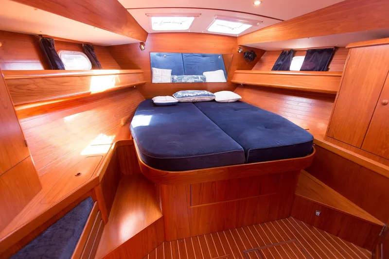 Slide: The Image of Luxurious cabin interior of 2002 Jeanneau Sun Odyssey 45.2 yacht with wooden finish. - 15