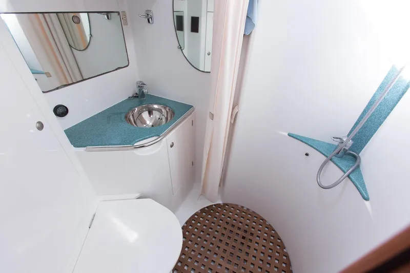 Slide: The Image of Bathroom interior of 2002 Jeanneau Sun Odyssey 45.2 yacht, featuring sink and shower. - 16