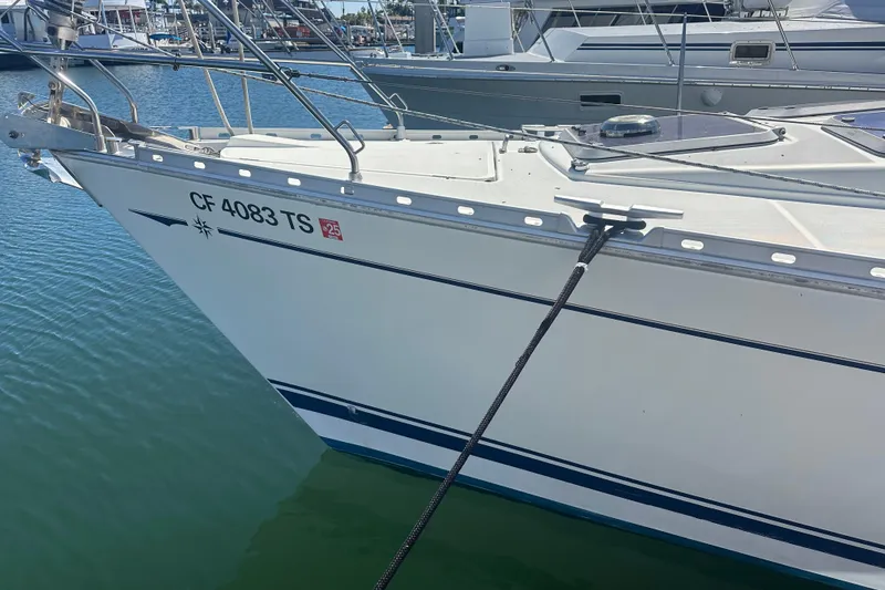 Slide: The Image of Jeanneau Sun Odyssey 45.2 sailboat docked, 2002 model, with visible registration number. - 19