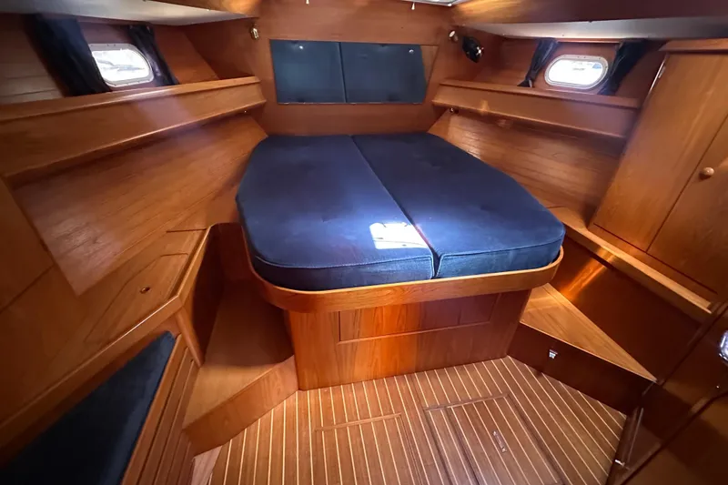 Slide: The Image of Luxurious cabin interior of 2002 Jeanneau Sun Odyssey 45.2 yacht with wooden finish. - 23
