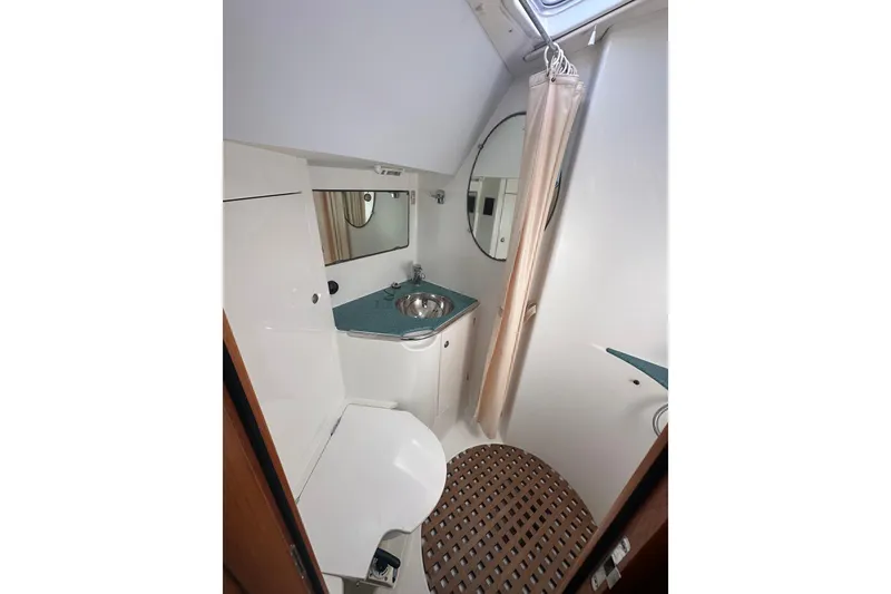Slide: The Image of Bathroom interior of 2002 Jeanneau Sun Odyssey 45.2 yacht, featuring sink and shower. - 24