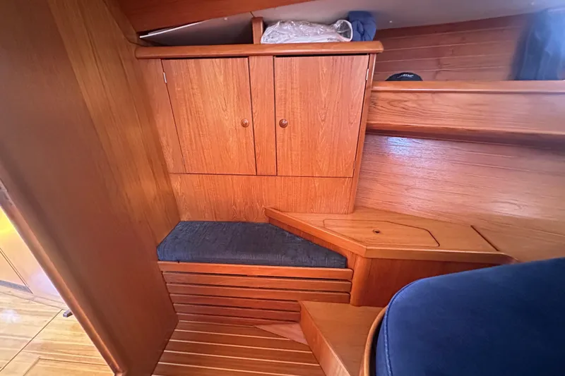 Slide: The Image of Interior of 2002 Jeanneau Sun Odyssey 45.2 yacht with wooden cabinetry and seating. - 25